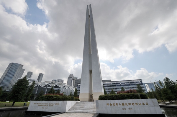 A picture shows the four pillars of the Civilian War Memorial standing 70 metres high in Singapore. The memorial is one of Singapore's most famous landmarks built in memory of civilians killed during the Japanese occupation of Singapore in World War II. (Roslan Rahman/AFP/Getty Images)
