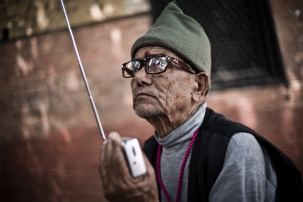 A man sits with his radio at a home for the elderly on the outskirts of Kathmandu. (Garry Waller)