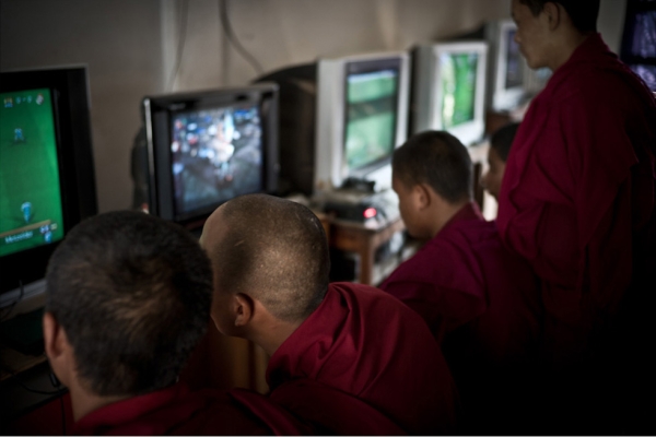 Buddhist monks play video games in the town of Boudha. (Garry Waller)