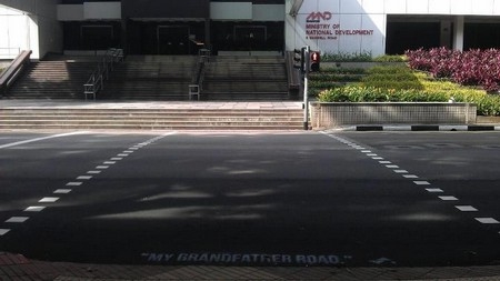 "My Grandfather Road," a Singlish colloquialism often used to condemn reckless drivers, spray-painted on Maxwell Road. (Samantha Lo/skl0.tumblr.com)