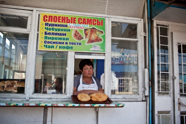 A shopkeeper looks out for customers in her snack shop selling somsa. (Sue Anne Tay)