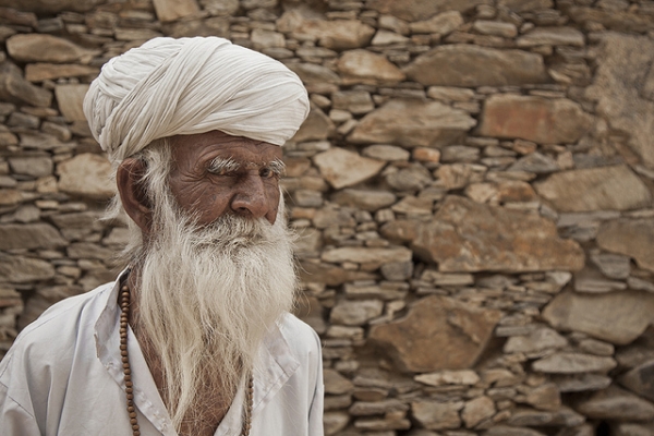 An old man looks suspiciously at the camera in Udaipur, India on February 12, 2012. (Meena Kadri/Flickr)