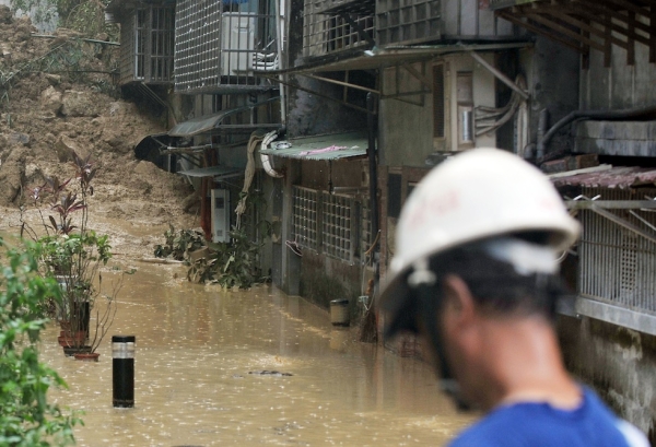 A relief worker at the scene of a mud slide in New Taipei City on August 2, 2012. (Mandy Cheng/AFP/GettyImages)