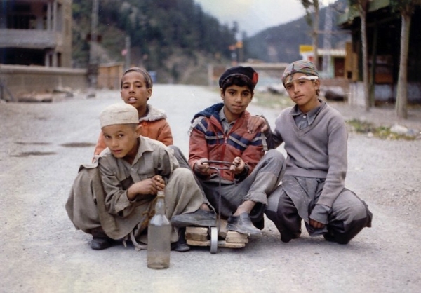Boys play with their soapbox car in Kohistan. (Jim/Flickr)