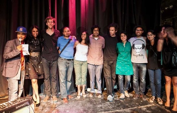 Participants and performers in the 2012 "Unification" event at the Nuyorican Poets Cafe in New York City take a collective bow on August 12, 2012. (Neha Gautam)
