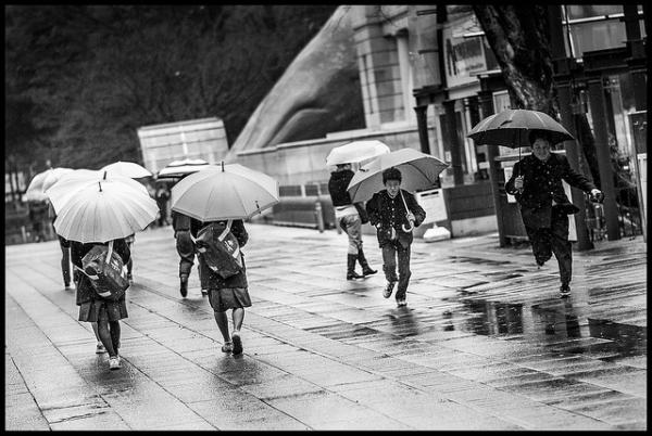 Children run through puddled Ueno Park, Tokyo on March 9, 2012. (Rob Shaw BFL/Flickr)