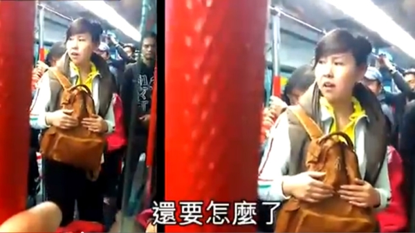 A mainland Chinese child was told not to eat on the Hong Kong trains by a local man, which escalated into a row between the child's mother and the man, on January 15, 2012. (Apple Daily/Youtube)