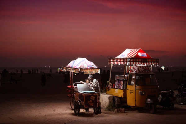 An ice cream vendor mans his post on the Alleppey beach in Kerala, India on May 22, 2012. (VinothChandar/Flickr)