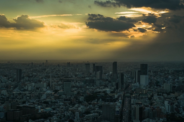 The sunrises over a bustling cityscape in Tokyo, Japan on September 11, 2012. (Guy Gorek/Flickr)