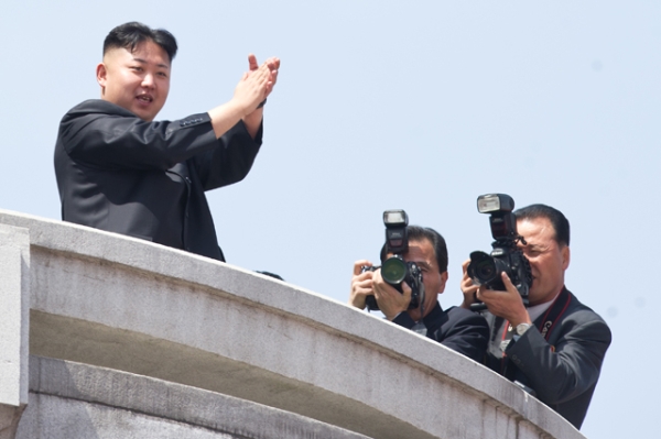 North Korean leader Kim Jong-Un (L) applauds during a military parade in honor of the 100th birthday of the late North Korean leader Kim Il-Sung in Pyongyang on April 15, 2012. (Ed Jones/AFP/Getty Images)