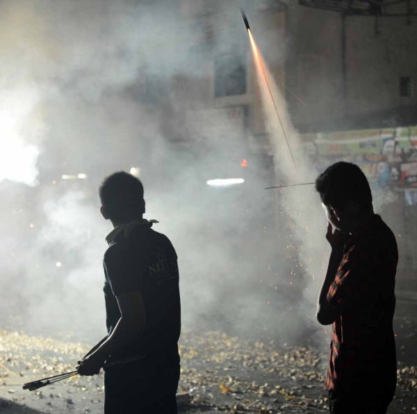 Revelers set off firecrackers in Manila on January 1, 2013. (Ted Aljibe/AFP/Getty Images)