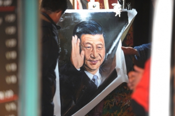 A painting of President Xi Jinping for sale in a Shanghai shop. (Peter Parks/AFP/Getty Images)