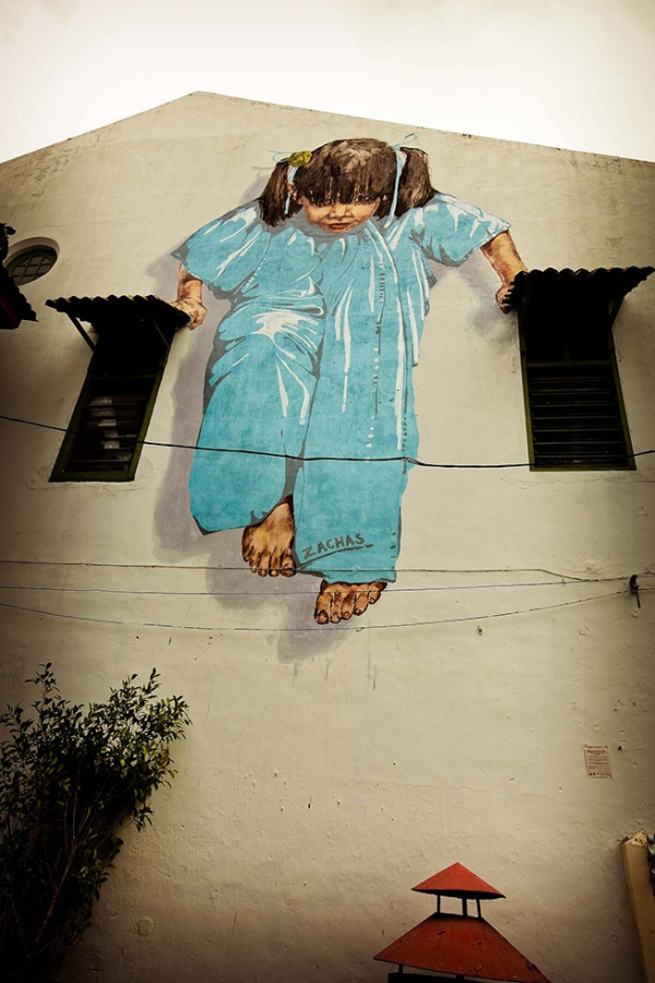 "Girl in Blue," a large Zacharevic mural in George Town, Penang. (Catherine Mar)

