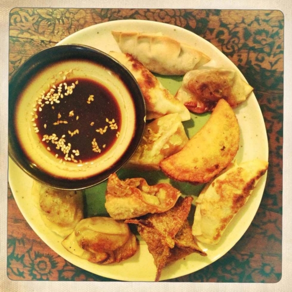 An assortment of dumplings accompanied by seasoned soy sauce for dipping. (Gigi Nguyen)