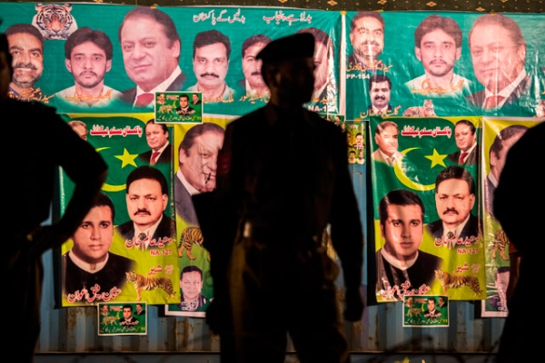 Punjab police wait for the arrival of Nawaz Sharif, leader of the Pakistan Muslim League-N (PML) party, during the final day of campaigning at an election rally in Lahore, Pakistan on May 09, 2013. (Daniel Berehulak/Getty Images)