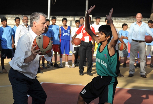 U.S. Ambassador to India Timoth Roemer plays basketball with Indian youths at a YMCA in Mumbai, India on May 11, 2010. (Sajjad Hussain/AFP/Getty Images)
