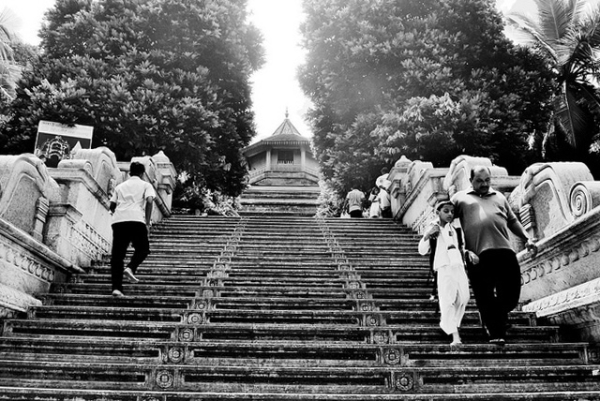 People make their way up and down the steps of Kelyani Temple in Sri Lanka on August 3, 2013. (Humans & Elephants/Flickr)