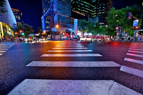Paths cross at a glitzy intersection in Shanghai, China on August 20, 2013. (SimonQ/Flickr)
