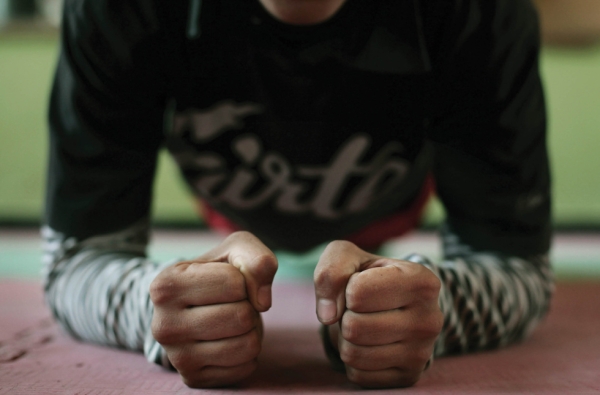 Kabul, 2010: A member of the Natioanl Women's Boxing Team warms up at the National Stadium, where she trains with other women three times a week. (Abbie Trayler-Smith)