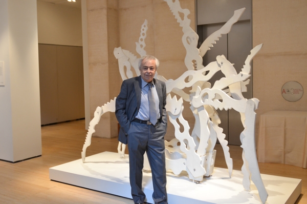 Artist Mohsen Vaziri-Moqaddam standing next to his sculpture, Untitled (Forms in Movement) created in 1970. (Ali Dadmarz)