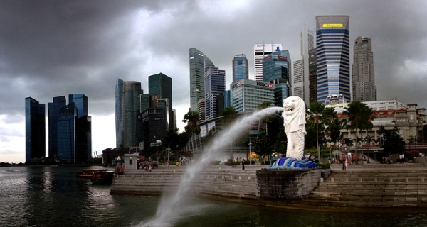 The Merlion is a mythical creature with the head of a lion and the body of a fish. Set against Singapore's skyline, the Merlion statue spouts water on November 14, 2013. (Gaelen/Flickr)