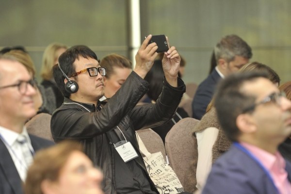 An attendee captures an image at the Arts & Museum Summit at Asia Society in Hong Kong on November 22, 2013. (Nick Mak/Asia Society)