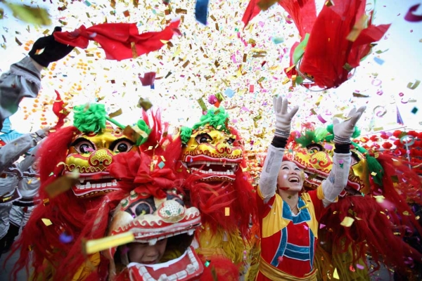 Chinese folk artists perform the lion dance at a temple fair on January 22, 2012 in Beijing, China. (Feng Li /Getty Images)