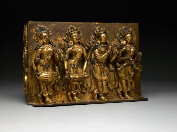 Panel of offering goddesses. Central Tibet. 14th century.  Gilt copper alloy with inlays of semiprecious stones. 10 1⁄8 x 15¼ x 6¼ in. (25.7 x 38.7 x 15.9 cm). Collection of David T. Owsley. (Brad Flowers; courtesy Dallas Museum of Art)