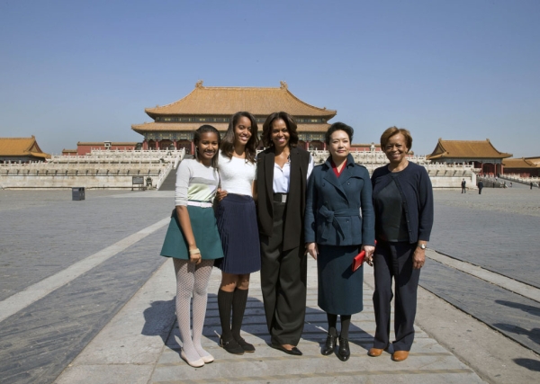 U.S. First Lady Michelle Obama (C), her daughters Sasha (L), Malia (2nd L), her mother Marian Robinson (R) and Peng Liyuan, wife of Chinese President Xi Jinping, pose for photographers in Beijing's Forbidden City on March 21, 2014. The Obamas arrived in Beijing to kick off a seven-day, three-city tour meant to focus on education and cultural exchange. (Andy Wong/AFP/Getty Images) 