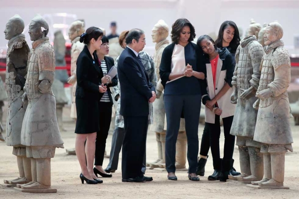  First Lady Michelle Obama (3rd R) with her daughters Malia Obama (R) and Sasha Obama (2nd R) visit the Museum of Terracotta Warriors during a visit to the historic excavation site in Xi'an on March 24, 2014. (Feng Li/Getty Images) 