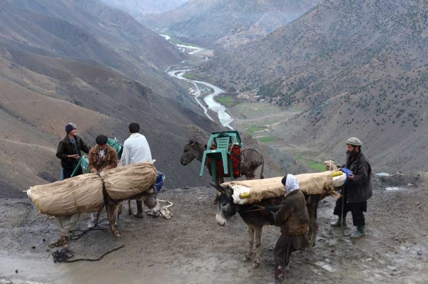 Afghan men load donkeys with election materials in the rugged mountains of the Panjshir valley on April 4, 2014. (Shah Marai/AFP/Getty Images)