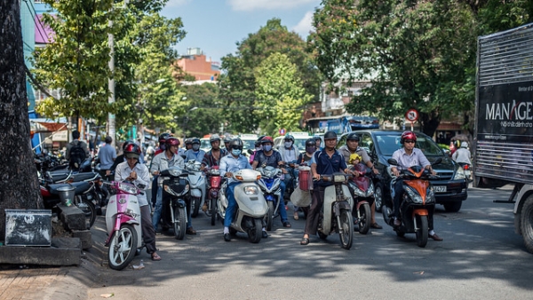 Rush hour takes on a new twist in Ho Chi Minh City, Vietnam as the streets are dominated by two wheeled vehicles on May 5, 2014. (hermitsmoores/Flickr)