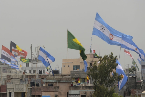The national flags of countries competing in the FIFA World Cup are flown above rooftops in the Bangladeshi town of Bardi, northwest of Dhaka, on June 10, 2014. (Munir Uz Zaman/AFP/Getty Images)
