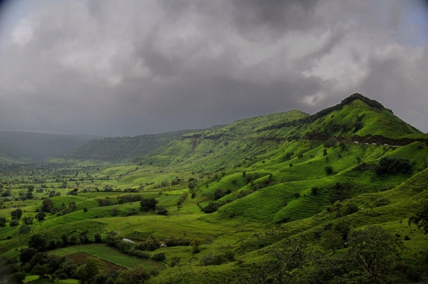Storm clouds gather over the lush, green hills of the Konkan Coast in India on August 14, 2014. (Amit Rawat/Flickr)