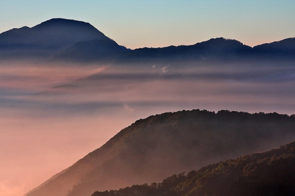 Wispy purple fog blankets dark mountains in Taroko National Park, Taiwan on November 1, 2014. (Mark Kao/Flickr)