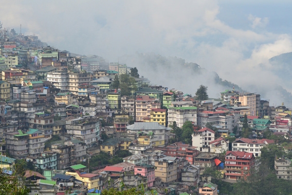 From a distance, the colorful buildings lining a valley look like a pack of boxes in Gangtok, Sikkim on May 8, 2014. (Kartik MS/Flickr)