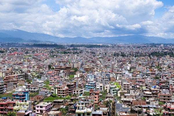 Against Nepal's mountainous skyline, multicolored residencies populate the land. (Eugene Kaspersky/Flickr)