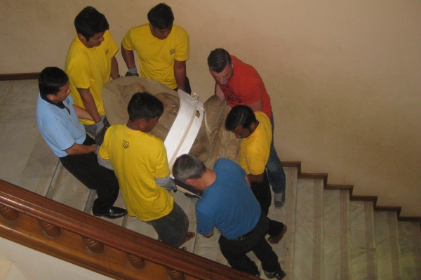 Careful coordination is necessary to move the object through the Bagan Archaeological Museum’s stairwell. (Clare McGowan/Asia Society)