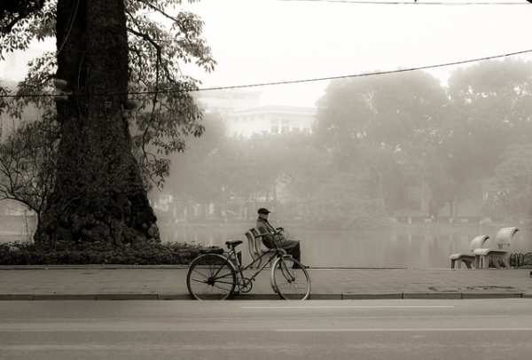 A man and his bicycle seem to be the only inhabitants of the early morning's streets in Ha Noi, Vietnam on February 17, 2015.  (Trường Đặng/Flickr)