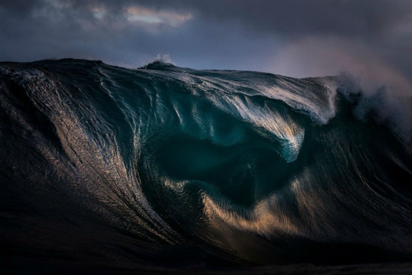 Light refracts through the curves of a breaking wave in New South Wales, Sydney, Australia. Photograph by Ray Collins. (Smithsonian.com)