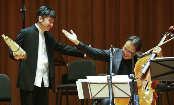 Wu is also a founding member of the Silk Road Ensemble with Yo-Yo Ma (R). (Courtesy of Wu Tong)