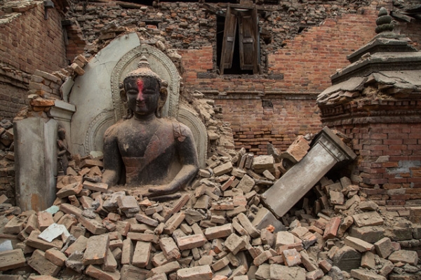 A Buddha statue is surrounded by debris from a collapsed temple in the UNESCO world heritage site of Bhaktapur on April 26, 2015 in Bhaktapur, Nepal. (Omar Havana/Getty Images)