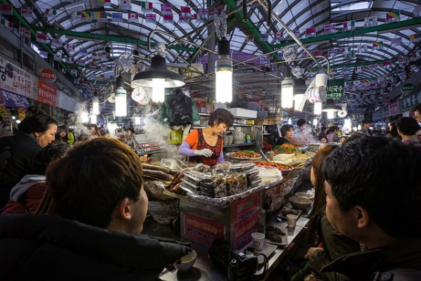 People enjoy a traditional Korean meal at a local market in Seoul, South Korea on April 5, 2015. (Brad Hammonds/ Flickr)