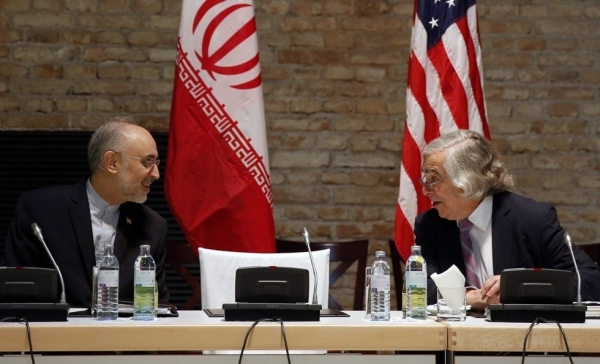 U.S. Secretary of Energy Ernest Moniz (R) and Head of the Iranian Atomic Energy Organization Ali Akbar Salehi (L) meet at a hotel where the Iran nuclear talks meetings are being held in Vienna, Austria on July 9, 2015. (Carlos Barria/AFP/Getty Images)