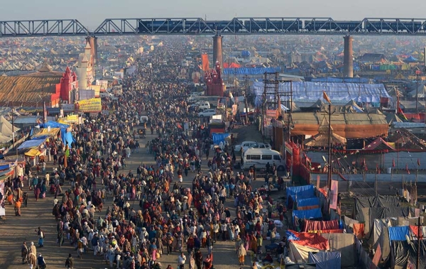 A large crowd makes its way on one of the pedestrian access points into the grounds of the Kumbh Mela, a day before authorities expect the largest crowd during the most auspicious day of the festival, in Allahabad on February 9, 2013. (Roberto Schmidt/AFP/Getty Images)