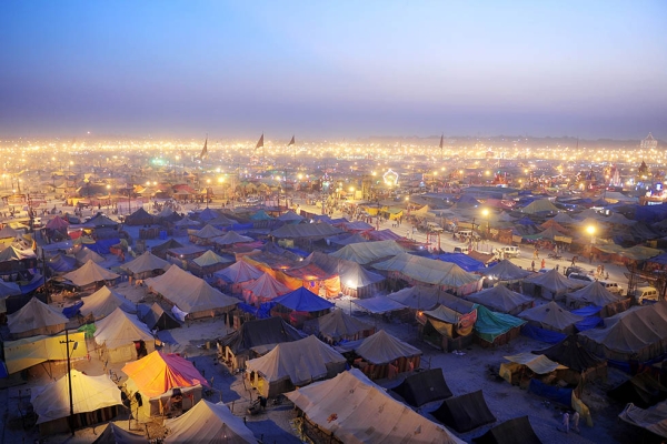 Temporary tents for devotees are pictured at dusk at Sangam, the confluence of the Rivers Ganges, Yamuna, and mythical Saraswati, during the Maha Kumbh Mela in Allahabad on February 13, 2013. (Sanjay Kanojia/AFP/Getty Images)