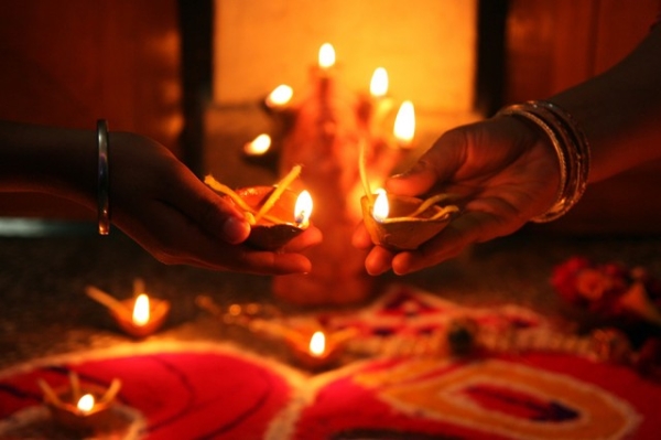 Devotees hold oil lamps as they celebrate Diwali in Allahabad on November 13, 2012. (Sanjay Kanojia/AFP/Getty Images)