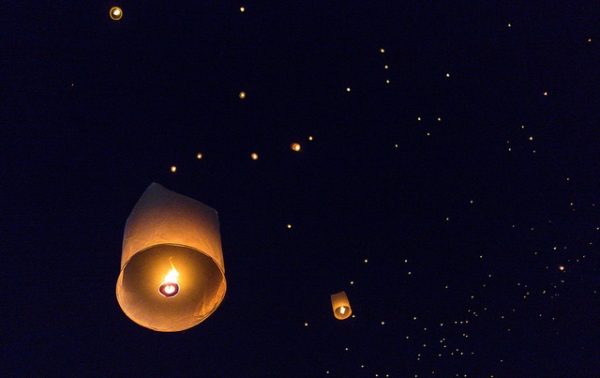 Twinkling lanterns float into the night sky during the Yi Peng Festival in Chiang Mai, Thailand on November 25, 2015. (Klim Levene/Flickr)