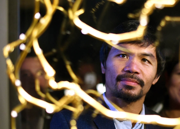 Boxer and politician Manny Pacquiao tours Asia Society's Philippine Gold exhibit at Asia Society in New York on October 12, 2015. Pacquiao was also the recipient of Asia Society's 2015 Asia Game Changer of the Year Award. (Timothy A. Clary/AFP/Getty Images) 