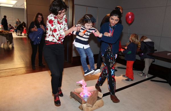 Children participate in a version of Chaharshanbeh Suri (fire jumping) to celebrate Nowruz at Asia Society New York on March 12, 2016.  (Ellen Wallop/Asia Society)